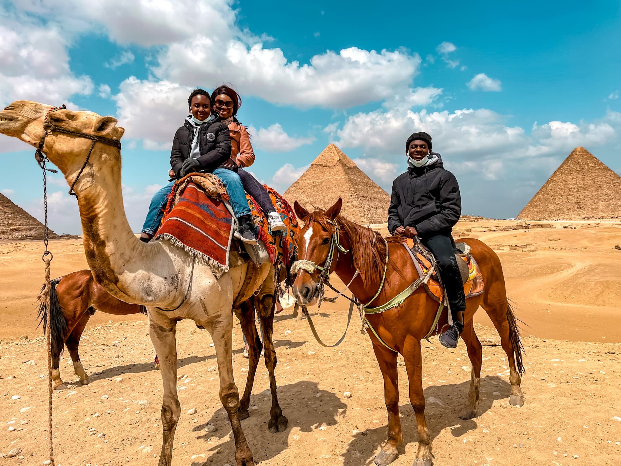 kalel riding on a horse, me and jorel riding on a camel